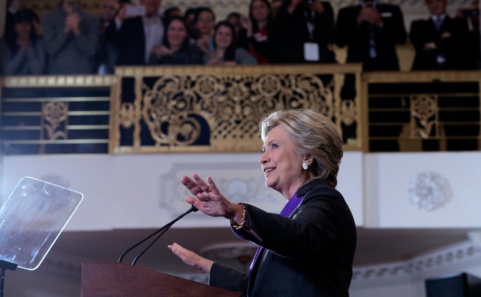 Elegant in a dark pantsuit – what else – with a purple blouse and lapels, in perhaps an unspoken nod to the need to unite the blue of the Democratic Party and the red of the Republicans, Clinton vowed to work with President-elect Donald Trump and urged fellow Democrats to do the same. Reuters Elegant in a dark pantsuit – what else – with a purple blouse and lapels, in perhaps an unspoken nod to the need to unite the blue of the Democratic Party and the red of the Republicans, Clinton vowed to work with President-elect Donald Trump and urged fellow Democrats to do the same. Reuters