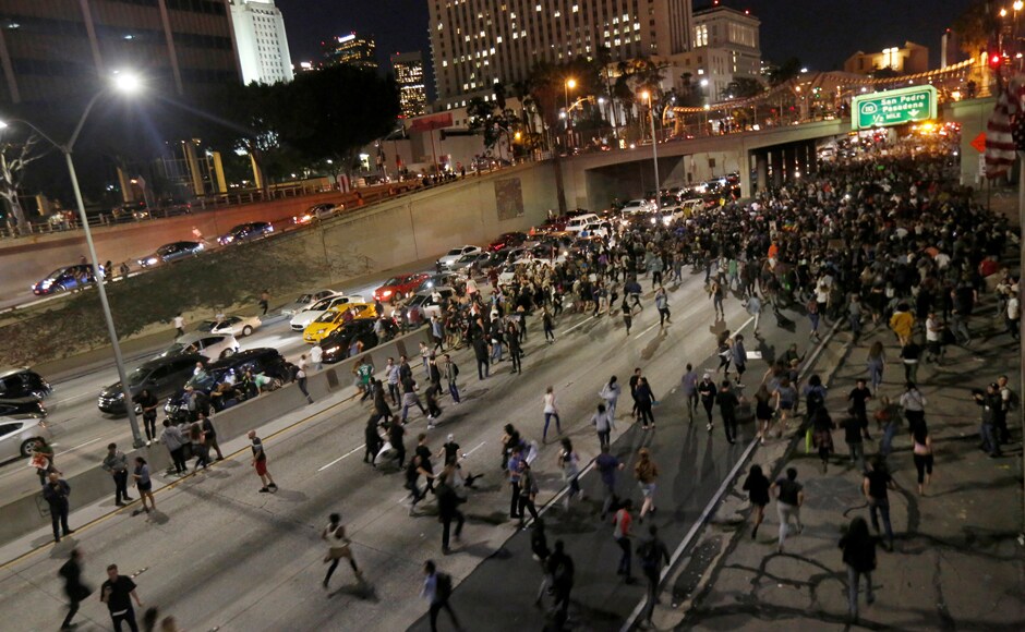 From New England to heartland cities like Kansas City and along the West Coast, demonstrators carried flags and anti-Trump signs, disrupting traffic and declaring that they refused to accept Trump's triumph. Reuters From New England to heartland cities like Kansas City and along the West Coast, demonstrators carried flags and anti-Trump signs, disrupting traffic and declaring that they refused to accept Trump's triumph. Reuters