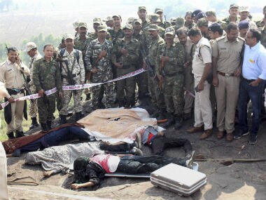 Police at the encounter site at the hillocks of Acharpura village after the STF killed 8 Students of Islamic Movement of India (SIMI) activists. PTI
