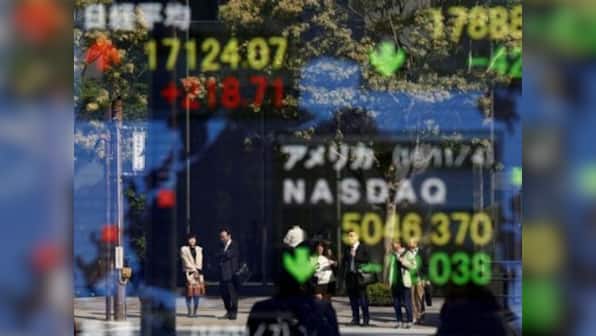 Asian shares, dollar, ride high as Hillary Clinton looks more likely to win US election