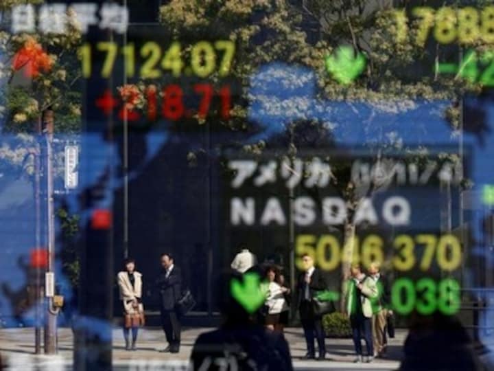 Asian shares, dollar, ride high as Hillary Clinton looks more likely to win US election