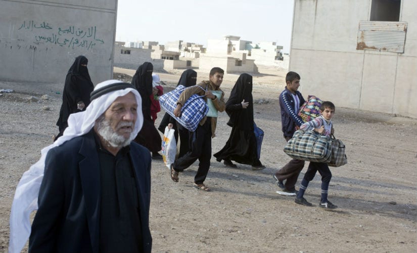 People fleeing from Mosul. AP