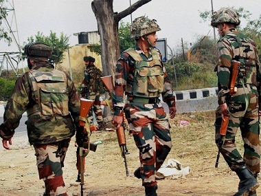 Army personnel take position during the encounter after militants attacked an army camp in Nagrota on the outskirts of Jammu on Tuesday morning. PTI