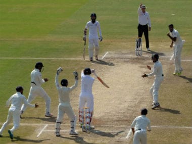 Indian players celebrate the wicket of England's Joe Root in the second Test at Vizag. AFP