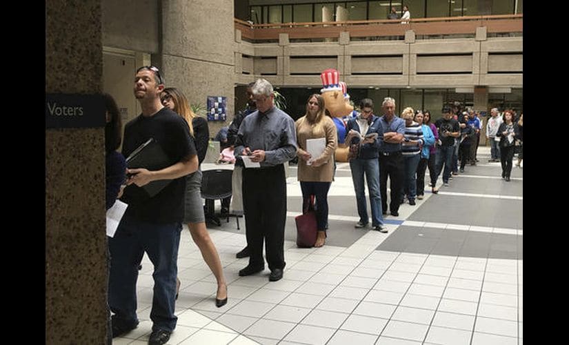 The line of voters waiting outside a building in San Jose. AP