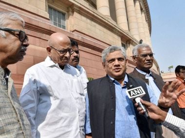 CPM general secretary Sitaram Yechury along with other leaders outside Parliament in New Delhi on Thursday. PTI