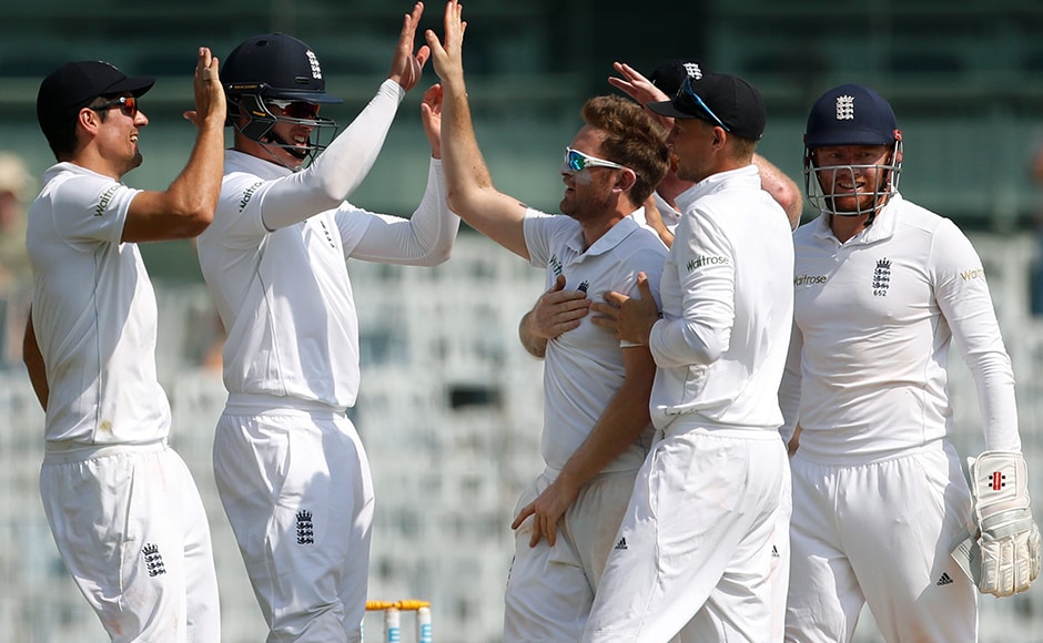 England’s captain Alastair Cook, first left, Keaton Jennings, second left, Liam Dawson, centre, and Joe Root, second right, celebrates the dismissal of India’s Murali Vijay during their fourth day of the fifth cricket test match in Chennai, India, Monday, Dec. 19, 2016. (AP Photo/Tsering Topgyal)