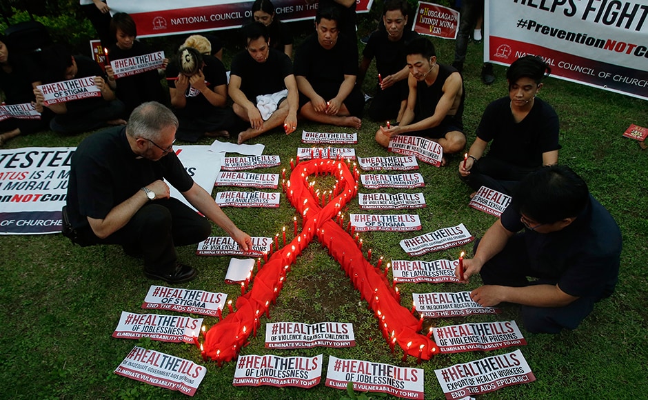 Awareness campaigns were organised across Phillipines as well, as people lit candles around the AIDS symbol at an event in observance of World AIDS Day in Quezon city. The group is calling for increased awareness to the rising number of HIV infections and AIDS-related cases and called on the government and other sectors to help break the social stigma brought about by the disease. AP Awareness campaigns were organised across Phillipines as well, as people lit candles around the AIDS symbol at an event in observance of World AIDS Day in Quezon city. The group is calling for increased awareness to the rising number of HIV infections and AIDS-related cases and called on the government and other sectors to help break the social stigma brought about by the disease. AP