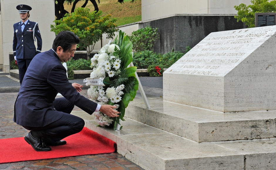 Abe landed at Joint Base Pearl Harbour-Hickam and then headed to National Memorial Cemetery of the Pacific, where he laid a wreath.(AP) Abe landed at Joint Base Pearl Harbour-Hickam and then headed to National Memorial Cemetery of the Pacific, where he laid a wreath.(AP)