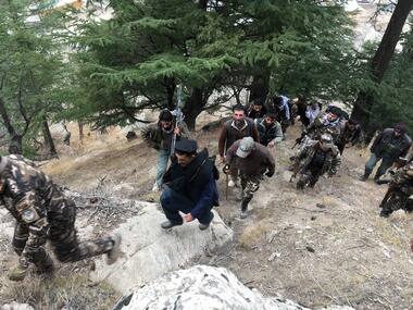 A file image of Afghan security forces and Afghan elders walking towards a check post in Parun, capital of Nuristan province, Afghanistan. Reuters