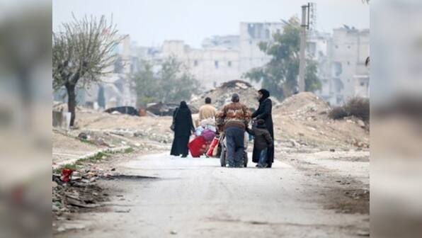 Thousands camp out in Aleppo desperate for resumption of evacuation
