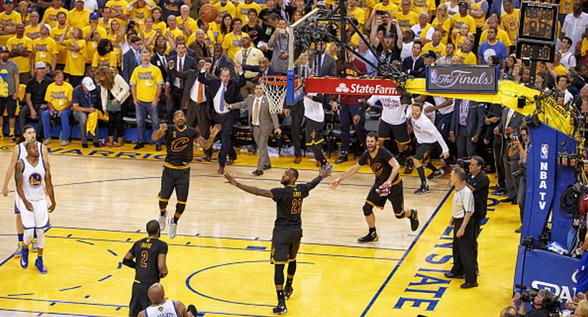 Cleveland Cavaliers players victorious on court after winning NBA Finals against Golden State Warriors. Getty