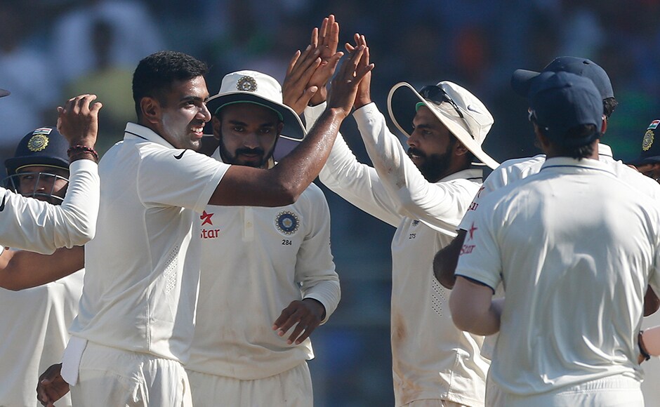 Indian players celebrates the wicket of England's batsman Jake Ball on the fifth day of the fourth cricket test match between India and England in Mumbai, India, Monday, Dec. 12, 2016. (AP Photo/Rafiq Maqbool)