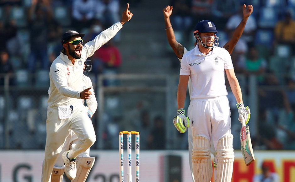 India's Virat Kohli (L) celebrates the wicket of England's Jonny Bairstow. REUTERS/Danish Siddiqui