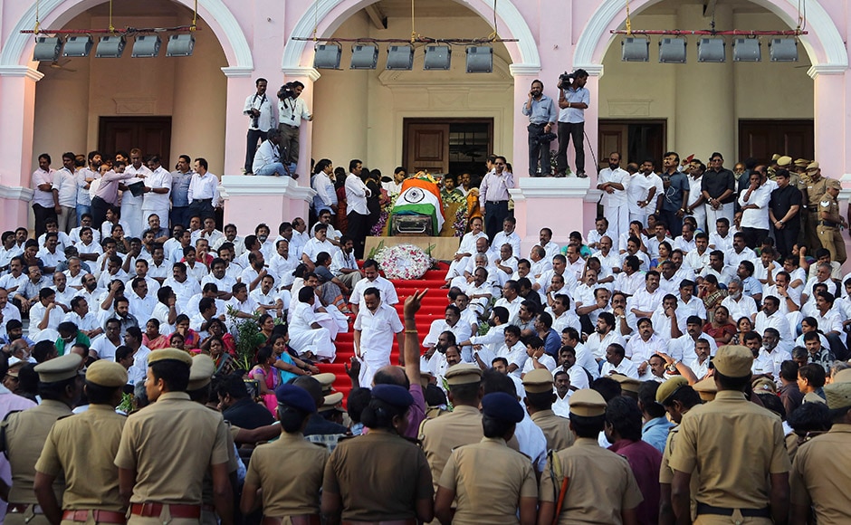 Body of India's Tamil Nadu state former Chief Minister Jayaram Jayalalithaa is wrapped in the national flag and kept for public viewing outside an auditorium in Chennai, India, Tuesday, Dec. 6, 2016. Jayalalithaa, the hugely popular south Indian actress who later turned to politics and became the highest elected official in the state of Tamil Nadu, died Monday. She was 68. (AP Photo/Aijaz Rahi)