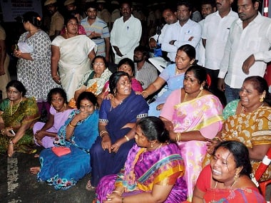 Chennai: AIADMK supporters sit in front of Apollo Hospital after Tamil Nadu Chief Minister, Jayalalithaa suffered a cardiac arrest in Chennai on Sunday. PTI Photo (PTI12_5_2016_000027B)