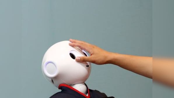 Flexible sensor 'skin' to help robots or prosthetic devices convey a sense of touch