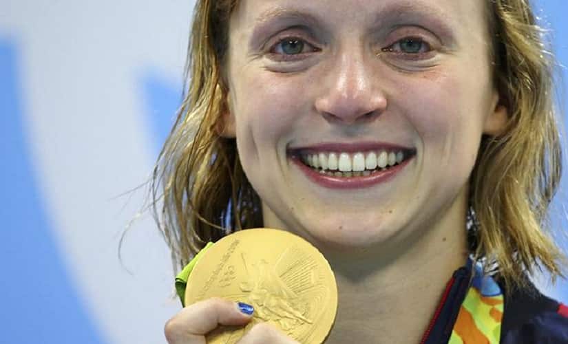 2016 Rio Olympics - Swimming - Victory Ceremony - Women's 800m Freestyle Victory Ceremony - Olympic Aquatics Stadium - Rio de Janeiro, Brazil - 12/08/2016. Katie Ledecky (USA) of USA poses with her gold medal on the podium. REUTERS/Dominic Ebenbichler FOR EDITORIAL USE ONLY. NOT FOR SALE FOR MARKETING OR ADVERTISING CAMPAIGNS.