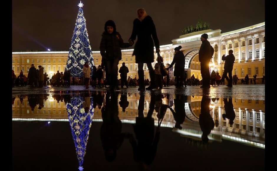 In Russia, many brazed the freezing temperatures and took part in traditional revelry. People gathered at the Dvortsovaya (Palace) square decorated for upcoming New Year and Christmas celebrations in St.Petersburg, on the Christmas eve. AP In Russia, many brazed the freezing temperatures and took part in traditional revelry. People gathered at the Dvortsovaya (Palace) square decorated for upcoming New Year and Christmas celebrations in St.Petersburg, on the Christmas eve. AP