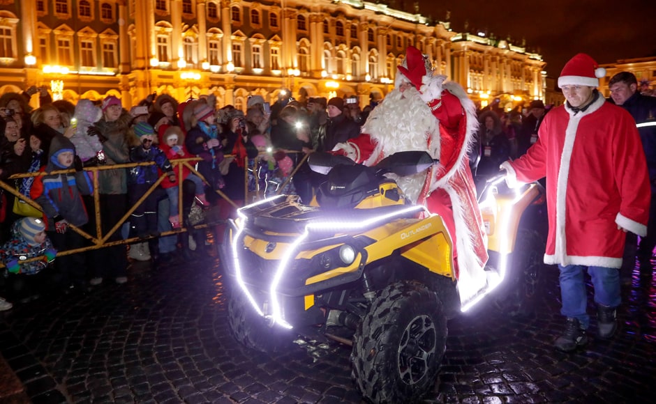 Ded Moroz (Grandfather Frost, the Russian Santa Claus) rode a quad bike this year as he arrived for the festivities of incoming New Year and Christmas at the Dvortsovaya (Palace) Square in St.Petersburg. AP Ded Moroz (Grandfather Frost, the Russian Santa Claus) rode a quad bike this year as he arrived for the festivities of incoming New Year and Christmas at the Dvortsovaya (Palace) Square in St.Petersburg. AP