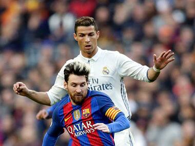 File photo of Barcelona's Lionel Messi and Real Madrid's Cristiano Ronaldo. AP