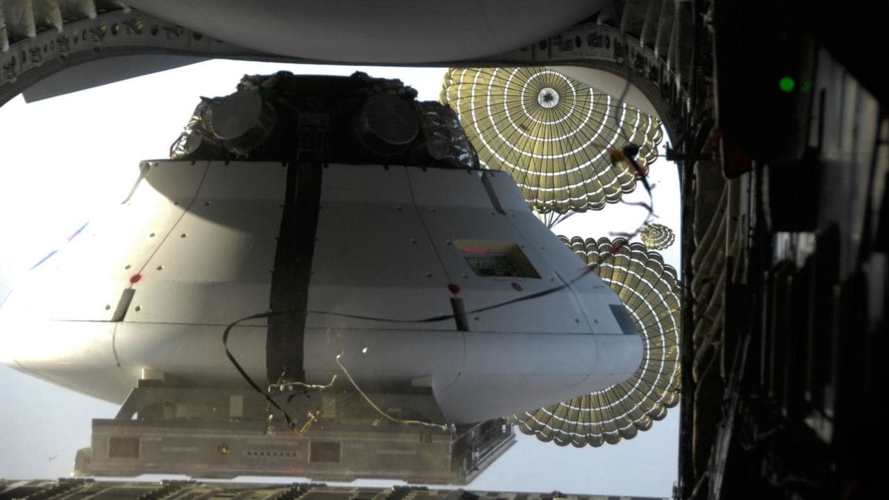 A test model of the Orion spacecraft with its parachutes was tested high above the skies over Arizona on Feb. 29. This particular drop test examined the wake – or the disturbance of the air flow behind Orion – that is caused by the spacecraft. This was the latest in a series of parachute drop tests conducted by NASA at the U.S. Army’s Proving Grounds in Yuma, Ariz. Photo credit: NASA