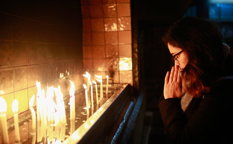 In Turkey, people offered their prayers and lit candles prior to a Christmas Eve mass in Sent Antuan church, the largest church of the Roman Catholic Church in Istanbul. AP In Turkey, people offered their prayers and lit candles prior to a Christmas Eve mass in Sent Antuan church, the largest church of the Roman Catholic Church in Istanbul. AP