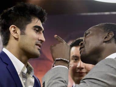 Indian boxing star Vijender Singh with  Francis Cheka. PTI