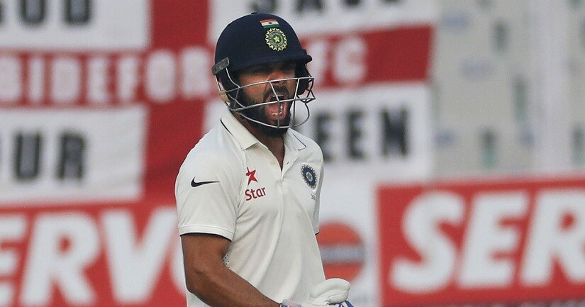 Captain Virat Kohli celebrates on day four of the Mohali Test againt England. AP