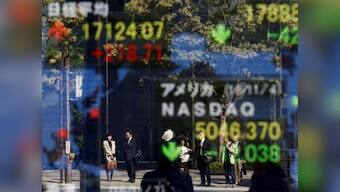 Wall Street surge provides relief to battered stock markets on upbeat US data