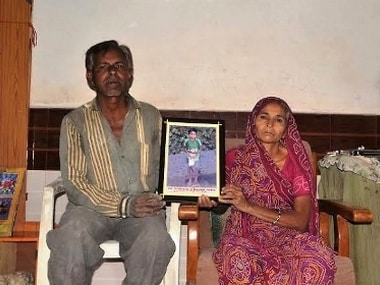 Jai’s parents show a framed photograph of the 11-year-old at their one-room rented house in Junagadh, Gujarat. A Thalassemic patient since he was just a year old, Jai had contracted HIV through blood transfusion at the Junagadh Civil Hospital.