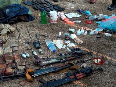Jammu: Army men showing arms and other items recovered from militants who attacked Nagrota camp, near Jammu on Wednesday. PTI Photo (PTI11_30_2016_000286B)