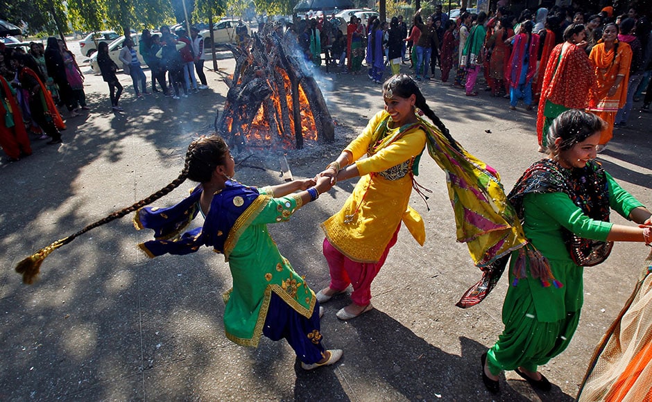 Students perform a traditional folk dance near a bonfire as they celebrate the Lohri festival, which marks the culmination of winter in many parts of northern India, inside a college in Chandigarh, India, January 13, 2017. REUTERS/Ajay Verma Students perform a traditional folk dance near a bonfire as they celebrate the Lohri festival, which marks the culmination of winter in many parts of northern India, inside a college in Chandigarh, India, January 13, 2017. REUTERS/Ajay Verma