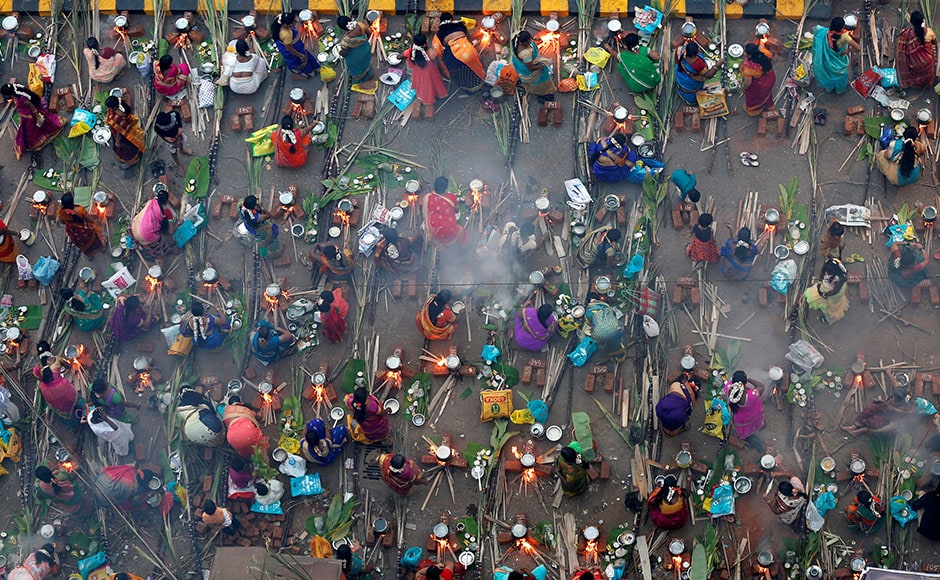 Devotees prepare rice dishes to offer to the Hindu Sun God as they attend Pongal celebrations early morning in Mumbai on 14 January, 2017. Reuters Devotees prepare rice dishes to offer to the Hindu Sun God as they attend Pongal celebrations early morning in Mumbai on 14 January, 2017. Reuters