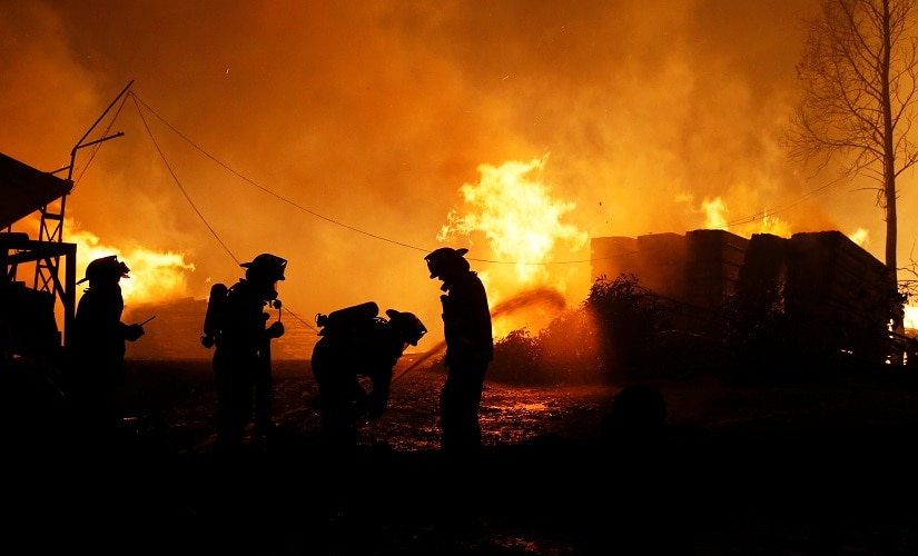 Firefighters try to stop the fire as the worst wildfires in Chile's modern history are ravaging wide swaths of the country's central-south regions, in Santa Olga, Chile on January 26. Reuters