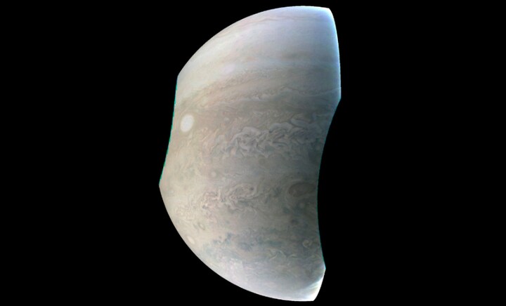 Juno probe reveals crescent shaped Jupiter with iconic Great Red Spot