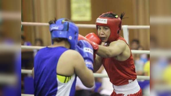 L Sarita Devi lets her gloves talk in victory over Zsofia Bedo on professional debut