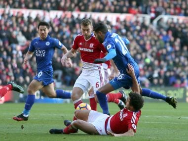 Middlesbrough's Fabio Pereira da Silva, on ground tackles Leicester City's Riyad Mahrez during their Premier League match. AP