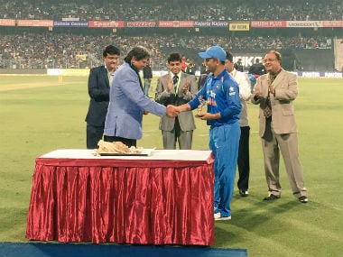 MS Dhoni being felicitated at Eden Gardens as Sourav Ganguly looks on. Image courtesy: Twitter/BCCI