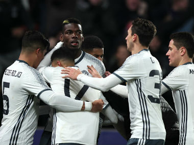 Paul Pogba of Manchester United celebrates with his team-mates after scoring a goal to make the score 1-1 during the EFL Cup Semi-Final second leg. Getty Images