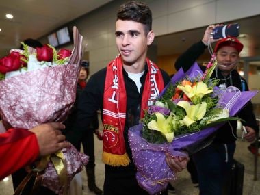 File photo of Oscar as he arrives at Shanghai airport to play for Shanghai SIPG. AFP