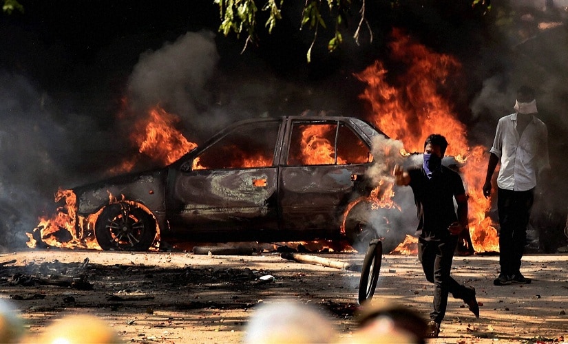 Pro-Jallikattu protesters during a violent clash with the police near Marina Beach in Chennai on Monday. PTI