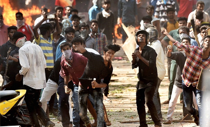 Pro-Jallikattu protesters during a violent clash with the police near Marina Beach in Chennai on Monday. PTI