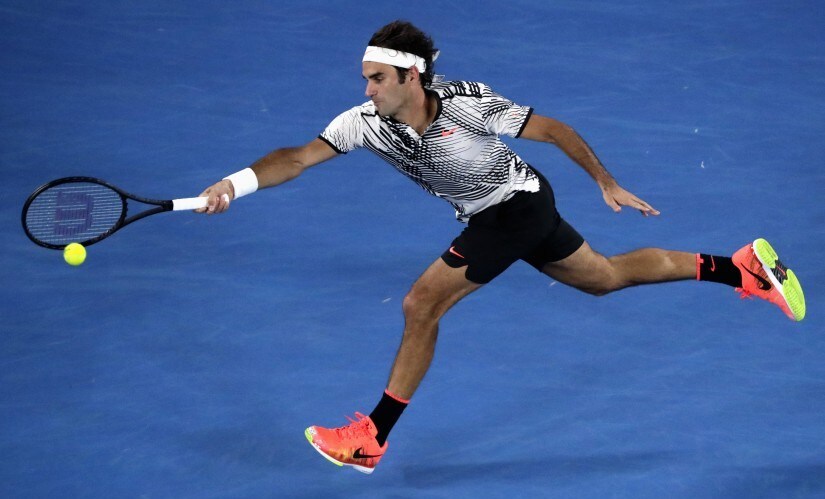 Roger Federer hits a shot during his Men's singles semi-final match against Stan Wawrinka. Reuters