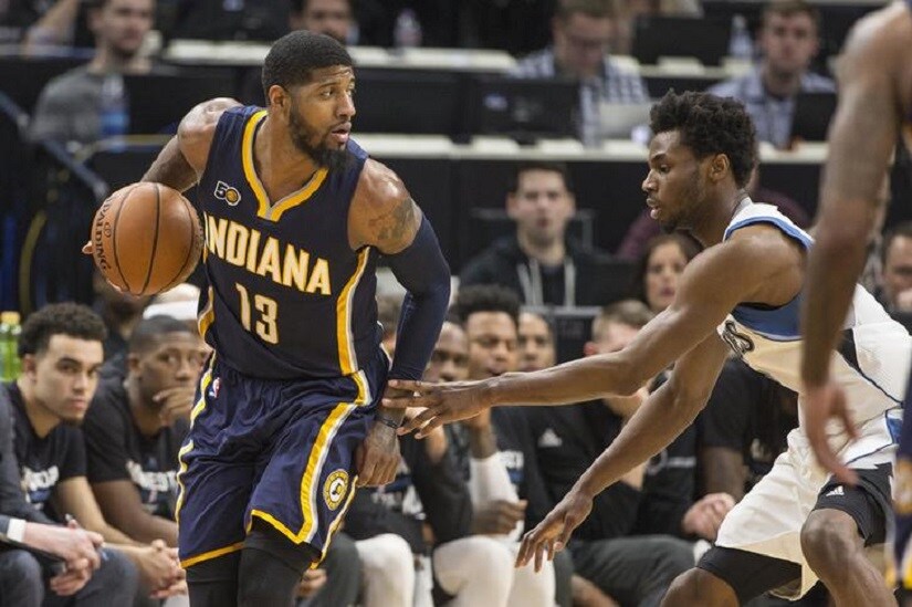 Jan 26, 2017; Minneapolis, MN, USA; Indiana Pacers forward Paul George (13) looks to pass the ball as Minnesota Timberwolves forward Andrew Wiggins (22) defends in the second half at Target Center. The Pacers won 109-103. Mandatory Credit: Jesse Johnson-USA TODAY Sports