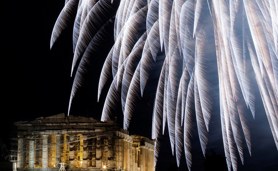 Fireworks explode over the ancient Parthenon temple atop Acropolis hill during New Year's day celebrations in Athens, Greece. Reuters Fireworks explode over the ancient Parthenon temple atop Acropolis hill during New Year's day celebrations in Athens, Greece. Reuters
