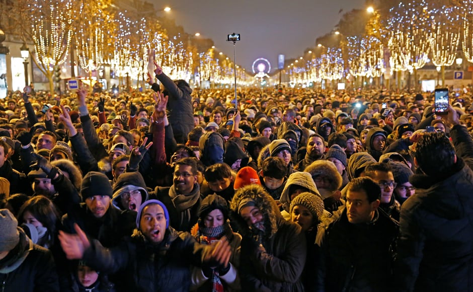 Revellers gather on the Champs Elysees Avenue in Paris, France, during New Year celebrations. Reuters Revellers gather on the Champs Elysees Avenue in Paris, France, during New Year celebrations. Reuters