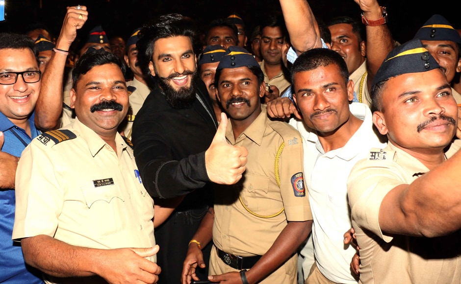 Ranveer and Mumbai's policemen pose for the shutterbugs together. Photo: Sachin Gokhale/Firstpost Ranveer and Mumbai's policemen pose for the shutterbugs together. Photo: Sachin Gokhale/Firstpost