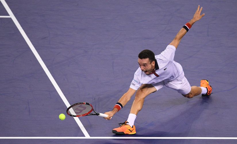 Roberto Bautista Agut hits a return against Novak Djokovic at the Shanghai Masters, a match that the Spaniard won. AFP