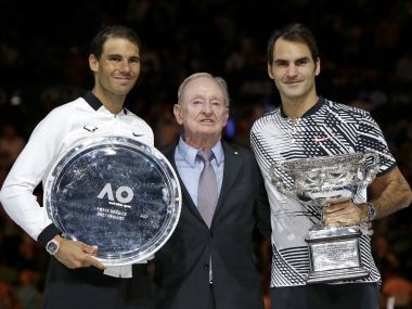 Roger Federer, Rafael Nadal and Rod Laver pose for photographers. AP